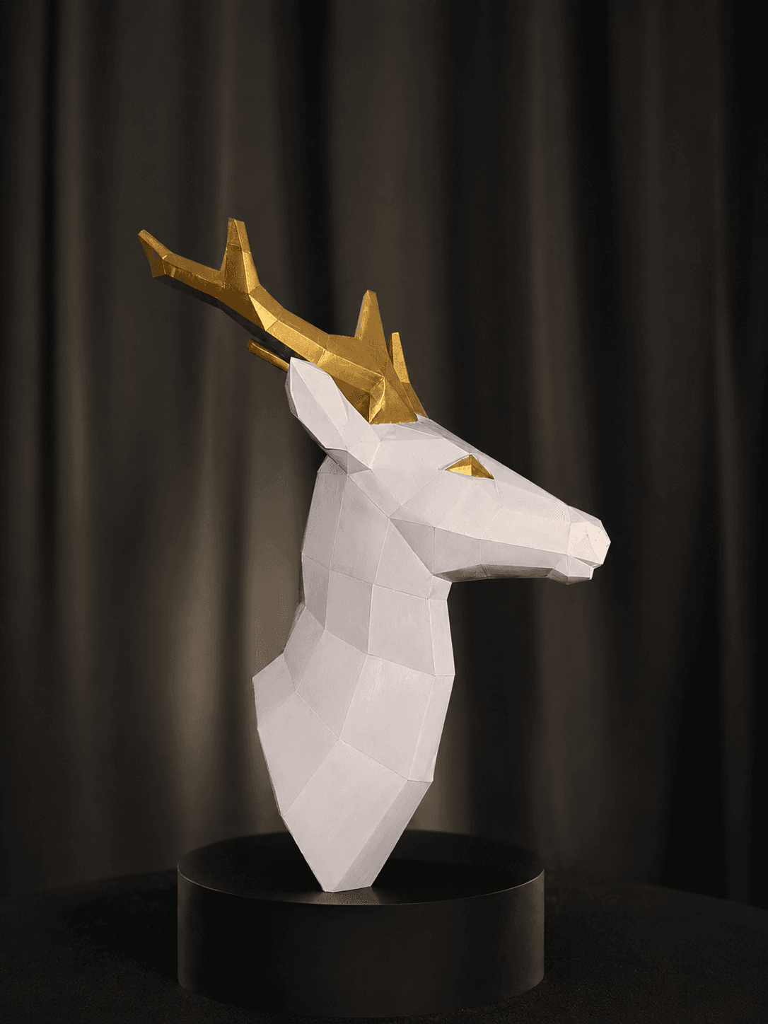 A paper deer with layered antlers