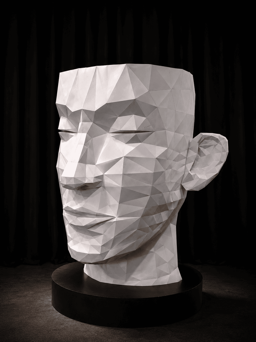 A faceted paper head